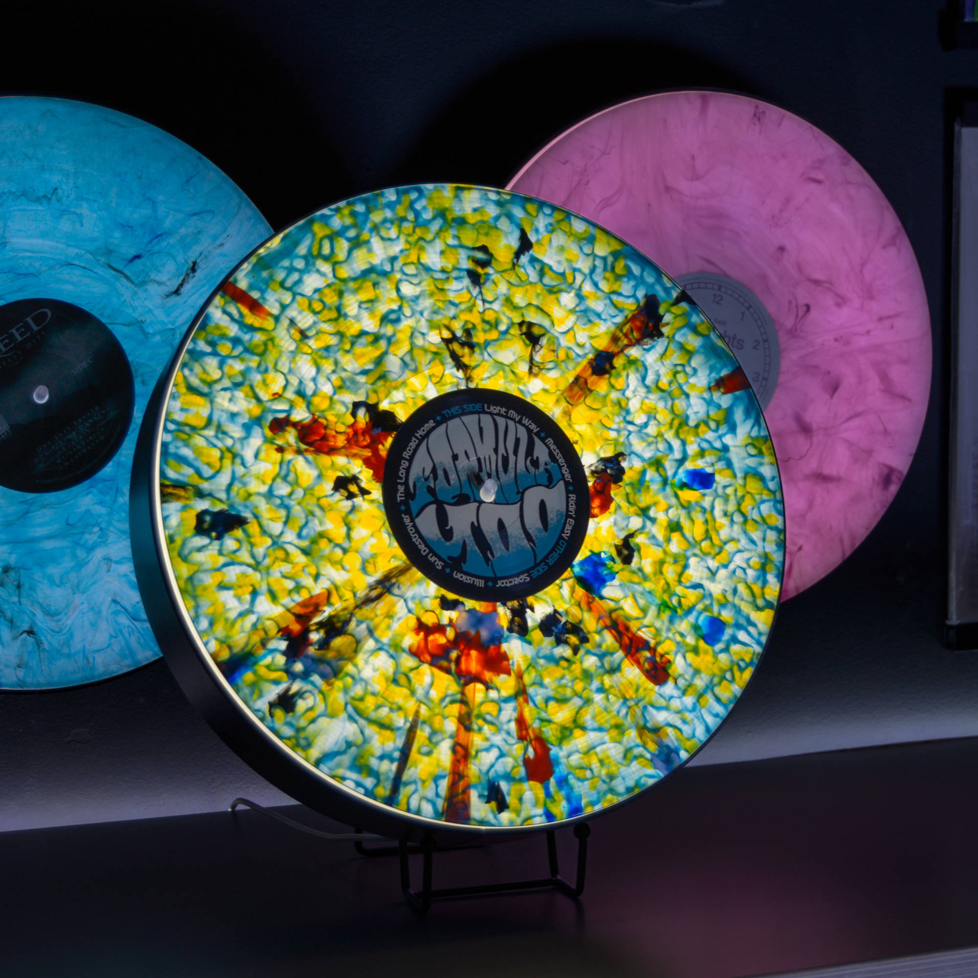Marbled and splatter pressings glowing on Vylümi displays